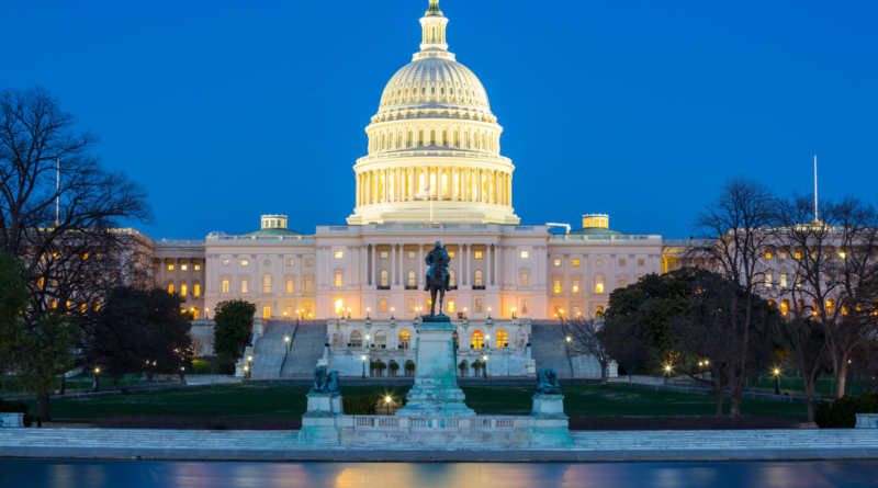U.S. Capitol building illuminated at dusk, representing the Trump election security strategy and the 2026 midterm debate.