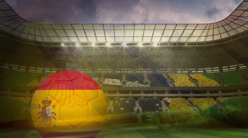 Soccer ball with the Spanish flag design in front of a packed stadium under bright floodlights, representing Spain's World Cup victory.